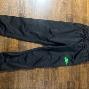 Nike Kids Black Joggers with Green Logo